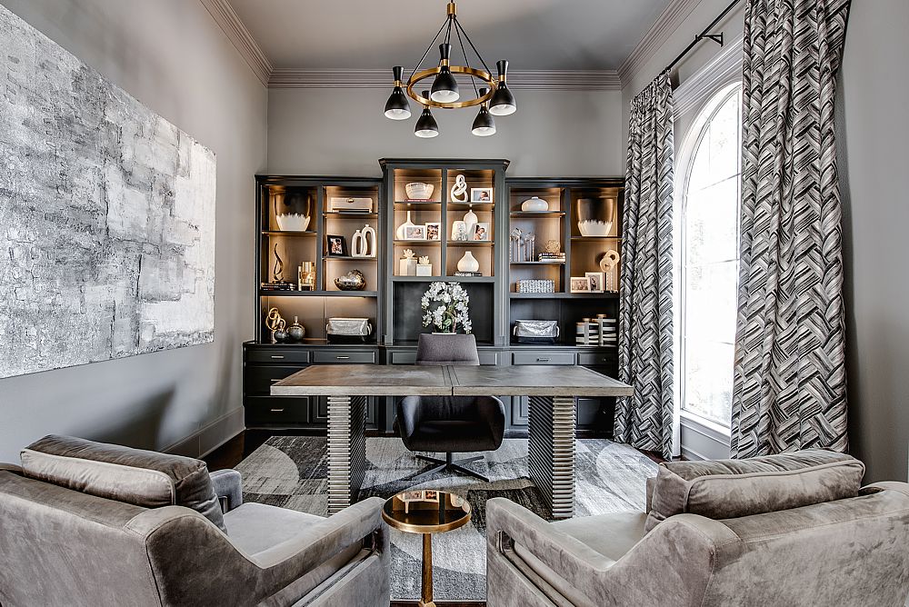 Luxury home office with custom built-in shelving and elegant lighting.